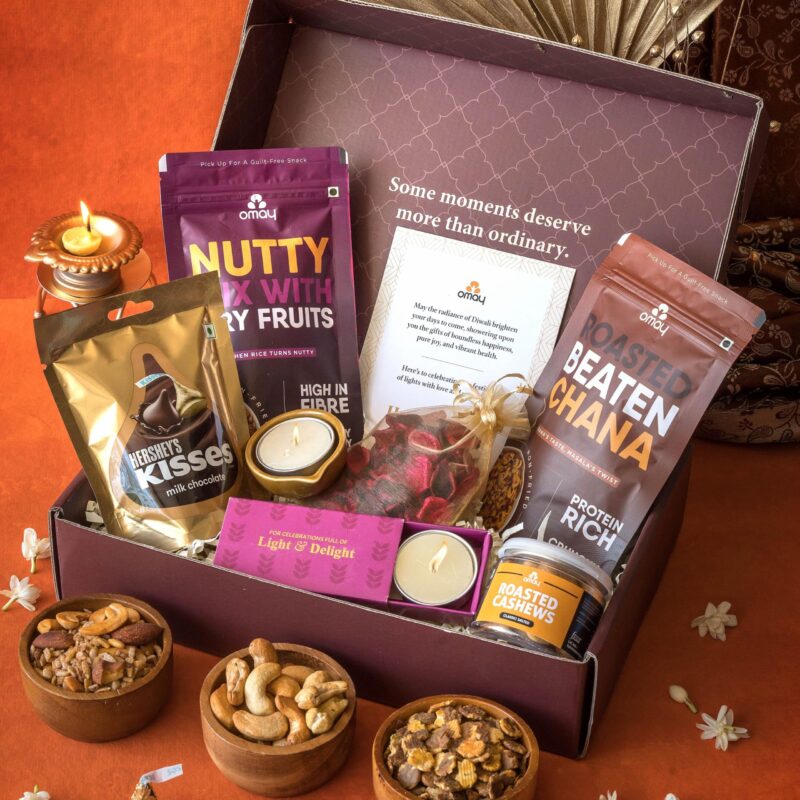Omay Foods 9 Pcs Festive Moments Diwali Gift Box l Diwali Gift Hamper I Corporate Deepawali Gifts I Healthy Snacks, Roasted Almonds, Hershey's Chocolates I Potpourri, Candles, Diya I Festive Hamper I Premium Gift Hamper
